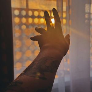 Natural sunlight filtering through white curtains in the morning.